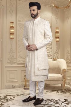 Make a grand entrance with our Mens Sherwani- U2-S342, the perfect choice for the stylish groom. The exquisite thread and stone embroidery adds a touch of royalty to this traditional garment. Walk down the aisle in style and make a statement with this sophisticated and exclusive piece. Nikkah Mens Outfit, Elegant Nehru Jacket With Dupatta For Reception, Elegant Ceremonial Churidar With Dupatta, Elegant Churidar With Dupatta For Ceremonial Occasions, Ceremonial Elegant Bandhgala With Dupatta, Elegant Ceremonial Bandhgala With Dupatta, Elegant Sherwani With Dupatta For Reception, Elegant Nehru Jacket With Dupatta For Ceremonial Occasions, Ceremonial Elegant Kurta With Traditional Drape