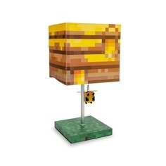 a lamp that is made out of lego blocks and has a yellow light on it