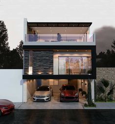 two cars parked in front of a modern house