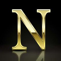 the letter n in gold metal on a black background