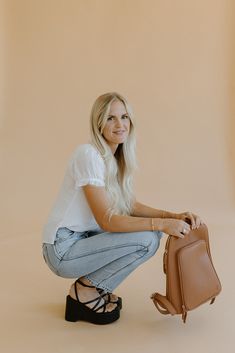 The Olivia Backpack is the most sleek and stylish backpack we've made! Conveniently made to store all the necessary things, including any 13" laptop. Plenty of pockets to hold and store all the essentials (phone, Chapstick, wallet, hand sanitizer, etc.). Use it for work, school, travel, and everything else in-between. There's a place for everything! This bag will quickly become one of your favorites. *Midnite version features all black hardware and bagstrap* Bag Details: Made with Premium Vegan Versatile Backpack With Laptop Sleeve For On-the-go, Versatile Daily Backpack With Laptop Sleeve, Versatile Daily Use Backpack With Laptop Sleeve, Versatile Backpack With Laptop Sleeve, Versatile School Backpack With Laptop Sleeve, Casual Leather Backpack With Cell Phone Pocket For Travel, Casual Leather Travel Backpack With Cell Phone Pocket, Modern Leather Backpack For Travel With Cell Phone Pocket, Modern Leather Backpack With Cell Phone Pocket For Travel