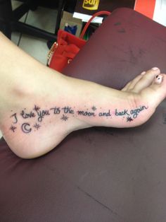 a woman's foot with the words i love you to the moon and back again written on it