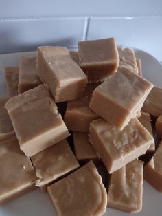 a white plate topped with cut up pieces of fudge