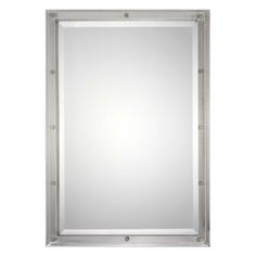 a square mirror with metal frame and silver trimmings on the bottom, against a white background