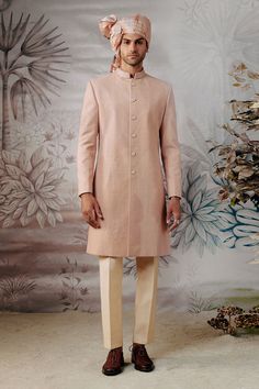 Ivory full sleeve sherwani made in silk base with all over thread embroidery in geometric pattern. Paired with an inner kurta and trouser. Comes along with a chanderi silk stole.
Components: 4
Pattern: Embroidery
Type Of Work: Thread
Neckline: Stand Collar
Sleeve Type: Full Sleeves
Fabric: 100% Silk 
Color: Ivory
Other Details: 
Embroidered collar
Four sided embroidered border stole
Note: Safa worn by the model and the blue outfit worn by the other model is not for sale
Occasion: Groom,Wedding - Designer Cream Nehru Jacket With Long Sleeves, Cream Sherwani With Chikankari Embroidery And Long Sleeves, Designer Cream Sherwani With Long Sleeves, Cream Long Sleeve Sherwani With Chikankari Embroidery, Designer Cream Long Sleeve Sherwani, Designer Long Sleeve Cream Sherwani, Designer Long Sleeve Beige Sherwani, Cream Long Sleeve Bandhgala With Naqshi Detail, Long Sleeve Cream Sherwani With Naqshi