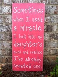 a sign that says, sometimes when i need a miracle i look into my daughter's eyes and really created one