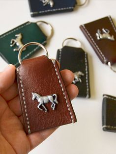 Measuring : width, length 3.4" The keychain is made of saddle leather. Stitched by hand. Material: saddle leather, rivet, keyring Style: horse, Equestrian, Purpose: leather for Every day, accessory for horses lover, pony or draft lover, gift for horse lover, Gift for the horse Mother, horse Dad for horse sister or broser:) Accessory for natural leather lover. Pony Tack, Horse Treats, Boys Gift, Gifts For Teen Boys, Face Jewellery, Horse Face, Horse Jewelry, Brown Horse