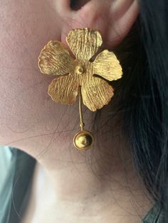 Shivka brings to you a masterful designer piece handcrafted by our skilled Indian craftsmen from Jaipur in brass with textured gold plating. Pick them up and make a statement! Length of earrings:5.6 cms Gold Brass Flower Earrings For Formal Occasions, Gold Flower-shaped Earrings For Festive Occasions, Formal Gold Flower Earrings In Brass, Formal Gold Brass Flower Earrings, Vintage 22k Gold Earrings, Traditional Hand Forged Gold Earrings, Vintage Gold Flower Shaped Earrings, Vintage Gold Flower-shaped Earrings, Gold Brass Earrings In Temple Jewelry Style