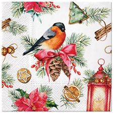 a christmas themed napkin with a bird and pine cone on it, surrounded by holiday decorations