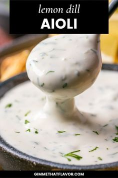 lemon dill aioli in a cast iron skillet with a ladle full of dip