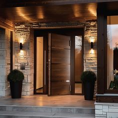 two planters are on the front steps of a house with stone walls and doors