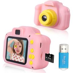 a pink digital camera next to a blue lighter