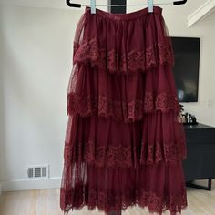 Mesh And Lace Layered Skirt In A Beautiful Burgundy Color. Spring Party Skirt In Burgundy, Red Ruffled Long Skirt, Red Long Skirt With Ruffles, Red Long Ruffled Skirt, Elegant Red Tiered Skirt, Red Ruffled Midi Skirt, Burgundy Lined Skirt, Red Ruffled Tiered Skirt, Party Burgundy Skirt