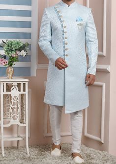 Ready-Made Sherwani With Trouser. Jacquard Brocade Fabric Top. Art Dupion Aligarhi Ready Made Trouser. Crafted in Chinese Collar Neck, and Full Sleeve. Satin Lining with Plain Work. High-Quality Matching Buttons. Please Note: The footwear shown in the picture is for presentation and photography purpose only. Color: There might be slight color variation due to lightings and flashes while photo shooting. The color may also vary because of different screen resolutions. Wash Care: Dry Clean Only. Light Blue Sherwani, Western Party Wear, Blue Sherwani, Indo Western Sherwani, Western Party, Western Parties, Chinese Collar, Readymade Saree, Dupion Silk