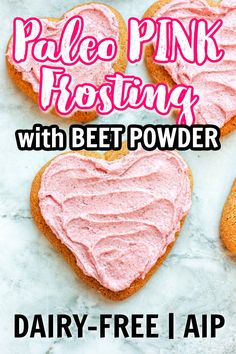 three heart shaped cookies with pink frosting on top and the words pale - free aip