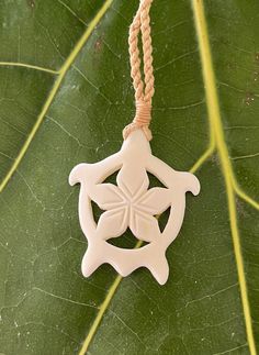 Hawaiian Plumeria Turtle Pendant with Adjustable Cotton Cord Necklace Pendant:  Approx. 2" x 1" Cord Necklace:  Approx. 28" long (Adjustable) Traditional Cream Necklace As A Gift, Traditional Cream Necklace For Gift, White Necklace With Adjustable Length, Carved Pendant Necklace Adjustable, Carved Pendant Jewelry, Adjustable Carved Pendant Necklaces, Adjustable Carved Pendant Jewelry, Adjustable Carved Pendant Necklace, Necklaces With Adjustable Cord And Flower Pendant