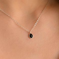 This dainty black Onyx pendant necklace has a delicate silver chain. The chain is solid sterling silver 925., and there is an extension so that the size can be adjusted. There are different stonees to choose from. The stones are natural stones and no 2 are identical, but they are similar. If you would like a custom order or have any questions please contact me, thanks. Elegant Black Drop Necklace Gift, Black Sterling Silver Teardrop Pendant Jewelry, Black Sterling Silver Jewelry With Teardrop Pendant, Black Teardrop Pendant Necklace Gift, Black Sterling Silver Necklace With Delicate Chain, Minimalist Black Teardrop Pendant Necklace, Dainty Black Sterling Silver Necklace, Minimalist Black Sterling Silver Necklaces, Minimalist Black Sterling Silver Necklace