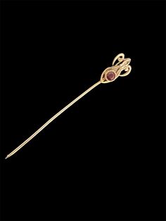 This stick pin is an excellent example of Art Deco design. It is 10KT gold with a lovely cut ruby stone.  Length of pin is approx. 6mm (2 1/4"). Width of front shield is 1mm at it's widest point. This would look great pinned in a suit lapel or cravat. stone is in very very good condition. I don't see any chips.  Also the gold has no color loss. Beautiful condition.  Beautiful piece and ready to give as a gift for the Holidays or that special occasion! Any questions please feel free to contact us. We guarantee our jewelry to be as stated and this piece is all original. 1930 Art, Ruby Stone, Stick Pins, No Color, Art Deco Design, Lapel Pins, Favorite Jewelry, Brooch Pin, Special Occasion