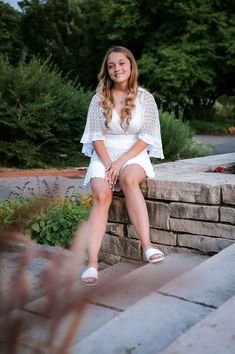 Minneapolis based senior photographer captures photos of a dreamy senior session outside for a girl wearing spring styled outfits including a white dress with sleeves, a short blue dress, and a black tshirt with white and black striped pants. #seniorgirloutfitideas #minnesotaseniorphotographer #minneapolisseniorphotographer #seniorphotoshootinspiration #seniorgirlposes #springseniorphotoshoot Black Striped Pants, White Dress With Sleeves, Short Blue Dress, Styled Outfits, Blue Dress Short, Picture Stand, Senior Picture Outfits, Capture Photo, Dress With Sleeves