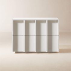 a white bookcase with six compartments on each side