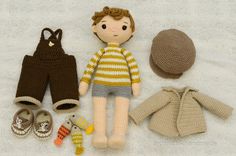 there is a knitted doll and other items on the ground