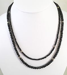 Black Double Strand Faceted Beads Jewelry, Black Double Strand Necklace With Beads, Black Double Strand Necklace With Black Beads, Elegant Double Strand Necklace With Black Beads, Elegant Double Strand Black Bead Jewelry, Elegant Black Spinel Beaded Necklace, Black Diamond Evening Jewelry, Elegant Round Black Crystal Necklace, Elegant Black Single Strand Crystal Necklace