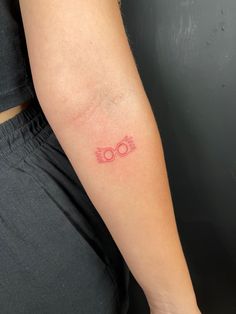 a person with a small tattoo on their arm