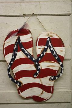 an american flag heart hanging on a wall