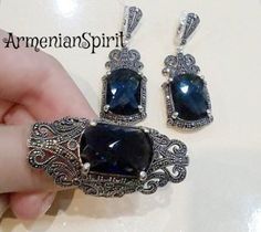 Navy blue SET silver marcasite jewelry armenian handmade very big ring very long earrings with blue stone Royal jewelry wedding dark blueYou can buy ring and earrings separately and in a set.In a set it will be cheaper.WE MAKE THIS SET IN ANY COLOR (stone): RED, BLUE, BLACK, BROWN, etc.RING:Weight: 11.8 gramsEARRINGS:The weight is approx. 14.6 gramsThe length approx.: 5 cm = 2 inchThe stone is lab topaz.Shipping time:Europe 3 weeks.USA and other countries 3 weeksI don`t accept returns and  excha Evening Jewelry In Sterling Silver With Intricate Design, Handmade Sterling Silver Jewelry For Evening, Elegant Pendant Earrings With Stone Setting, Traditional Silver Jewelry For Evening, Handmade Blue Jewelry For Evening, Elegant Handmade Jewelry For Evening, Formal Sapphire Jewelry In Metal, Handmade Sapphire Jewelry For Formal Events, Handmade Sapphire Jewelry For Formal Occasions