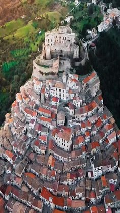 an aerial view of a city with red roofs