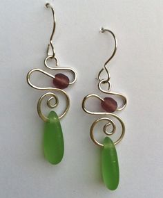 the earrings are made with wire and glass beads