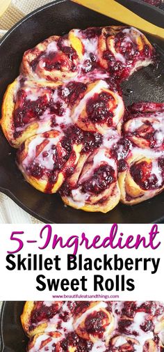 a skillet filled with sweet rolls covered in icing and cranberry sauce