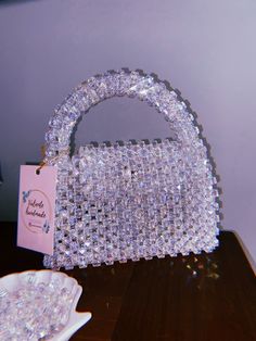 "100% handmade 🤍 Welcome to my store! Each bag is created with love and attention to detail, making them truly one-of-a-kind. Size: > width - 18 cm > height -  12 cm (20 cm with handle) The bags are strong enough to carry all your daily essentials, shiny enough to make your evenings sparkle, and with their unique designs, you can be sure to stand out from the crowd. Let's add a new one to your collection. 💞 Please feel free to contact me with any questions or special requests by pressing the \"Message seller\" button at the bottom of the page. Check out more of our unique designs:  https://www.etsy.com/shop/ValienteHandmadee" Trendy Handmade Evening Bag For Gift, Trendy Beaded Evening Bag As Gift, Trendy Beaded Evening Bag Perfect As A Gift, Handmade Rectangular Evening Bag For Party, Handmade Handheld Evening Bag For Party, Glamorous Beaded Bags As Gifts, Handmade Square Clutch For Party, Handmade Square Evening Bag For Party, Glamorous Beaded Clutch As Gift