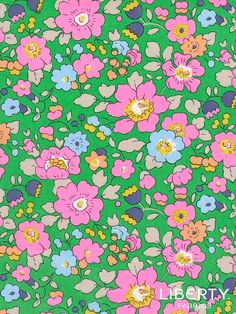 a green background with pink and blue flowers