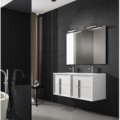 a modern bathroom with black walls and flooring is pictured in this image, there are two sinks on either side of the bathtub