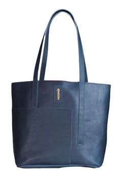 "Handmade asymmetric leather tote bag.  This bag has a pocket on the front and a zipper pocket on the inside. It is fully lined with LHB logo lining and has a magnetic snap closure. *color may vary from images* measurements L - 15\" W - 5\" H - 13\"" Blue Leather Shoulder Bag With Zipper Pocket, Blue Business Shoulder Bag With Zipper Pocket, Modern Shoulder Bag With Flat Pocket For Daily Use, On-the-go Tote Shoulder Bag With Flat Pocket, Leather Tote Shoulder Bag With Flat Pocket, Modern Blue Bags With Leather Lining, Leather Tote Bag With Flat Pocket, Modern Bags With Flat Pocket For Daily Use, Leather Shoulder Bag With Flat Pocket