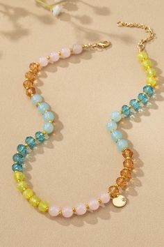 Brighten up your jewelry collection with this colorful natural stone and glass Aqua Beaded Necklace. Material: Glass and Natural Stone