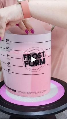 a woman holding onto a frosted cup with the words frost form on it and her hand