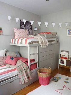 a child's bedroom with bunk beds, dressers and other items in it