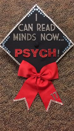 a black and red graduation cap that says i can read minds now psych on it