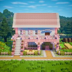 a pink house with stairs and flowers in the front yard, surrounded by greenery