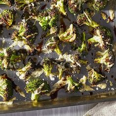 broccoli florets are on a baking sheet