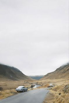 a car is parked on the side of a road