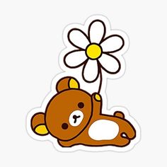 a brown teddy bear laying down next to a flower sticker on a white background