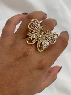 -14k butterfly ring  -100% 14k gold  -size 7  -cubic zirconia  -tricolored  -item sold by piece. Weight undetermined Butterfly Charm Ring For Anniversary, Luxury Diamond Butterfly Ring, Elegant Anniversary Rings With Butterfly Charm, Luxury Butterfly-shaped Anniversary Rings, Luxury Butterfly Shaped Anniversary Rings, Luxury Gold Butterfly Ring For Anniversary, Formal Yellow Gold Butterfly Ring With Cubic Zirconia, White Gold Butterfly Ring For Anniversary, Luxury Gold Butterfly Ring