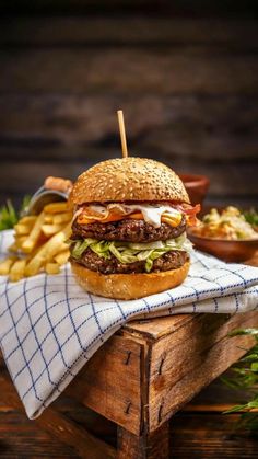 a hamburger sitting on top of a wooden table