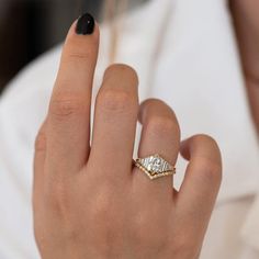 a woman's hand with a ring on it