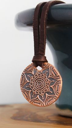 This simple yet stunning mandala necklace is the perfect piece to keep you centered. A mandala is a sacred space, often a circle, which reveals inner truth about you and the world around you. Speak, the universe is listening. ❤ 23mm Copper disc with mandala pattern ❤ 3mm Deer skin lace - choose your length Bohemian Jewelry With Large Pendant For Meditation, Bohemian Circle Jewelry For Gifts, Bohemian Medallion Necklace With Large Pendant For Gift, Bohemian Medallion Jewelry For Meditation, Bohemian Necklace With Large Pendant For Meditation, Bohemian Bronze Medallion Necklace As Gift, Bohemian Bronze Medallion Necklace For Gift, Adjustable Medallion Jewelry For Meditation, Adjustable Round Spiritual Medallion Necklace