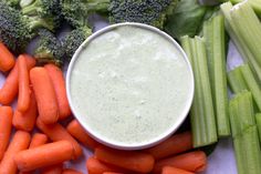 carrots, celery, and broccoli on a table