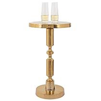 two glasses are sitting on top of a gold stand with one glass in the middle